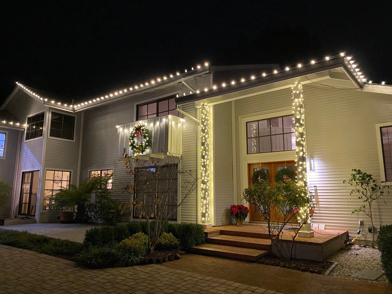 Custom warm white holiday lighting on a Bay Area home